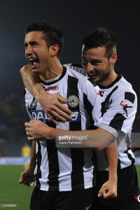 Giampiero Pinzi (L) of Udinese Calcio celebrates the opening goal with Giovanni Pasquale during the Serie A match between Udinese Calcio and SSC Napoli